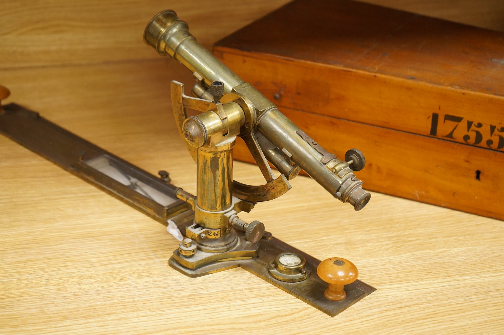 A German brass alidade by F. Sartorius, Göttingen, number 1755, 58.5cm wide, contained within a fitted birch case with applied maker’s label and other reference markings, the case; 63cm wide, 14cm high, 25cm deep at the